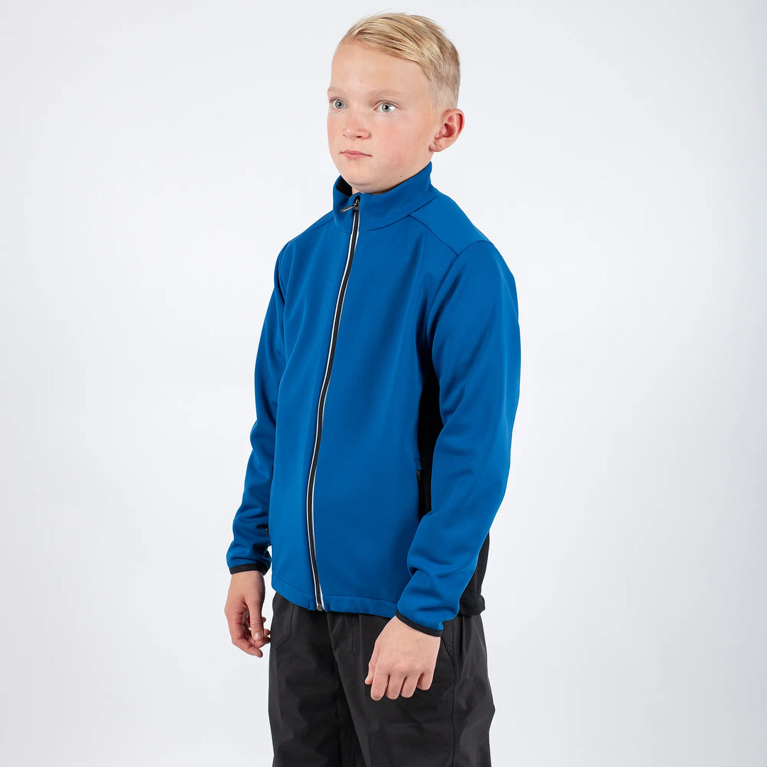 Ridley is a Windproof and water repellent golf jacket for Juniors in the color Blue Bell(1)