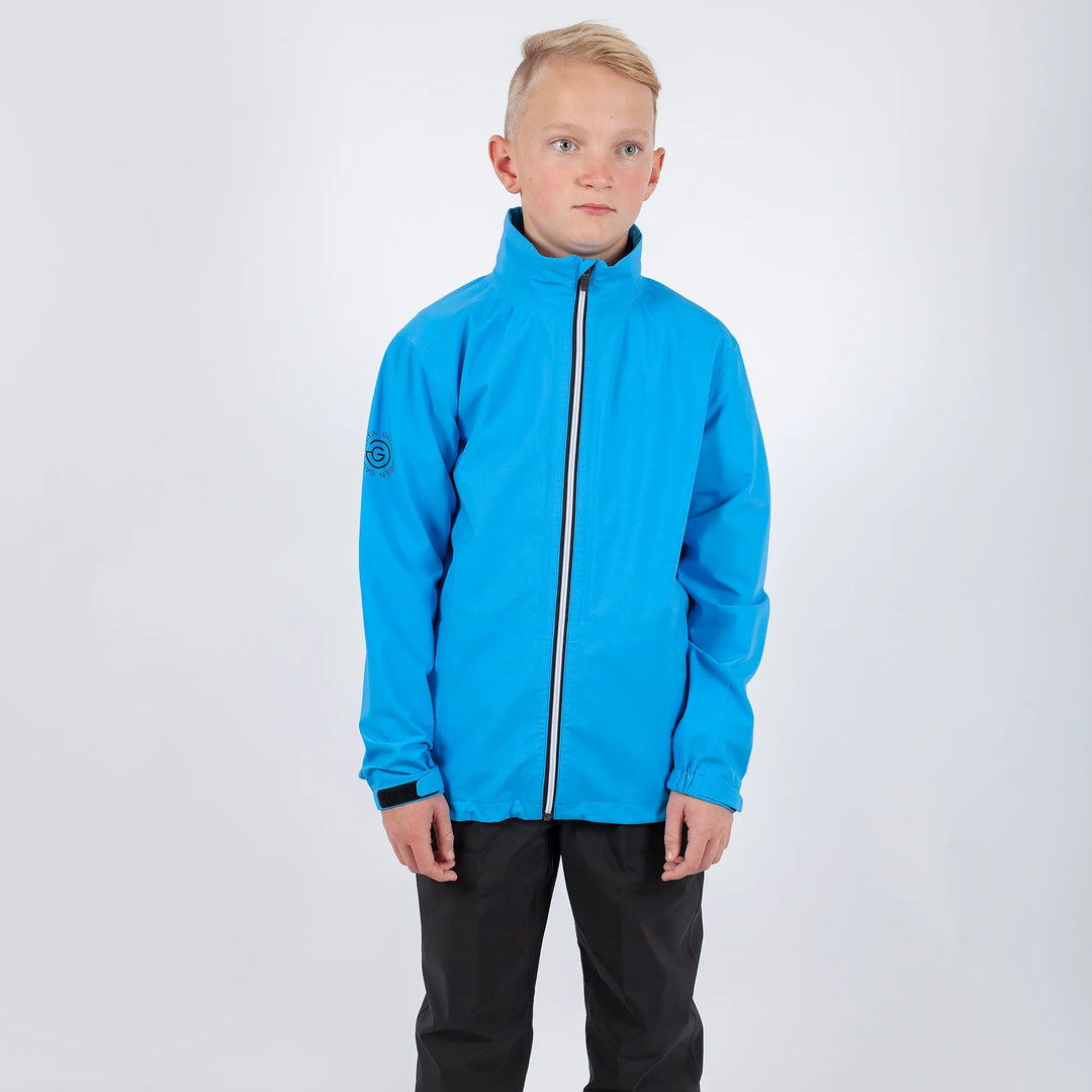 River is a Waterproof golf jacket for Juniors in the color Blue Bell(1)