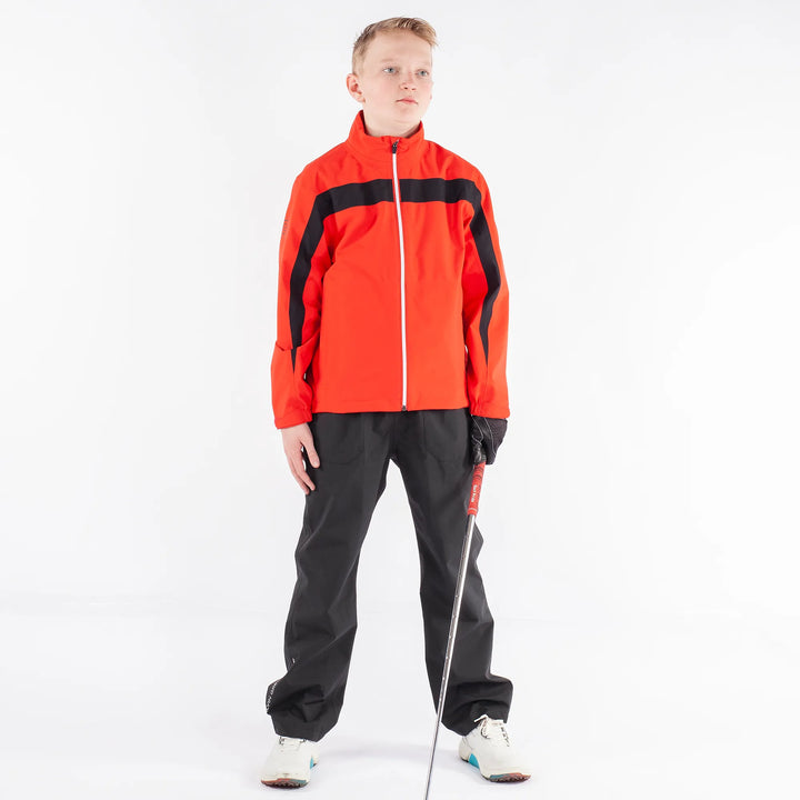 Robert is a Waterproof golf jacket for Juniors in the color Red(1)