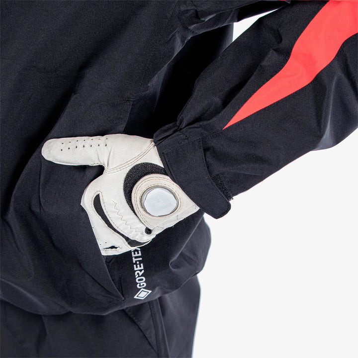 Robert is a Waterproof golf jacket for Juniors in the color Black/Red(5)
