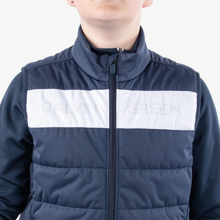 Ronie is a Windproof and water repellent golf vest for Juniors in the color Navy/White(4)