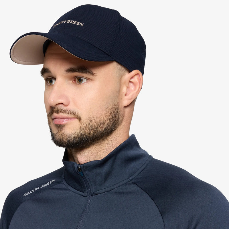 Shane is a Breathable golf hat in the color Sand/Navy(1)