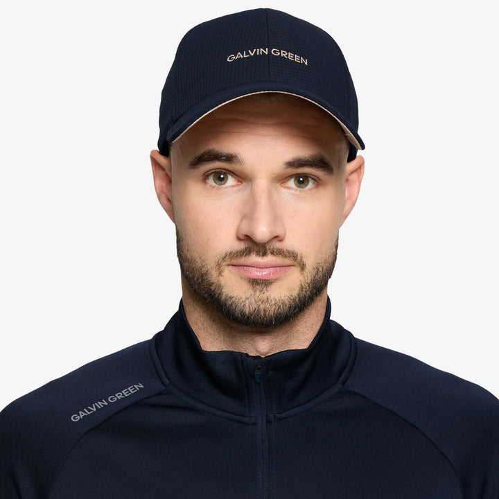 Shane is a Breathable golf hat in the color Sand/Navy(2)
