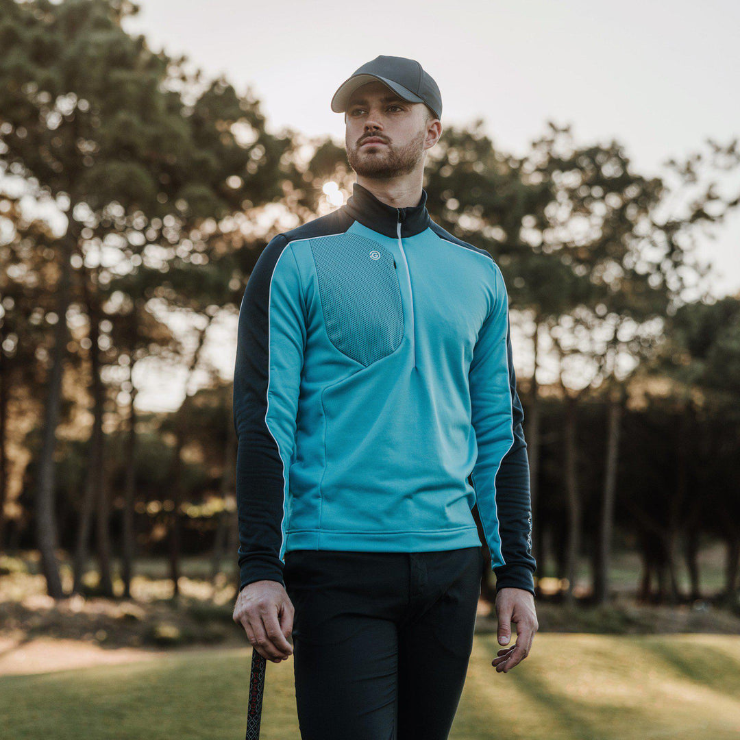 Dave is a Insulating golf mid layer for Men in the color Aqua/Navy(9)