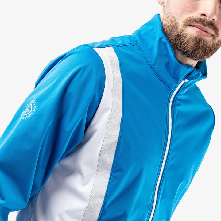 Lucien is a Windproof and water repellent golf jacket for Men in the color Blue/White/Cool Grey(4)