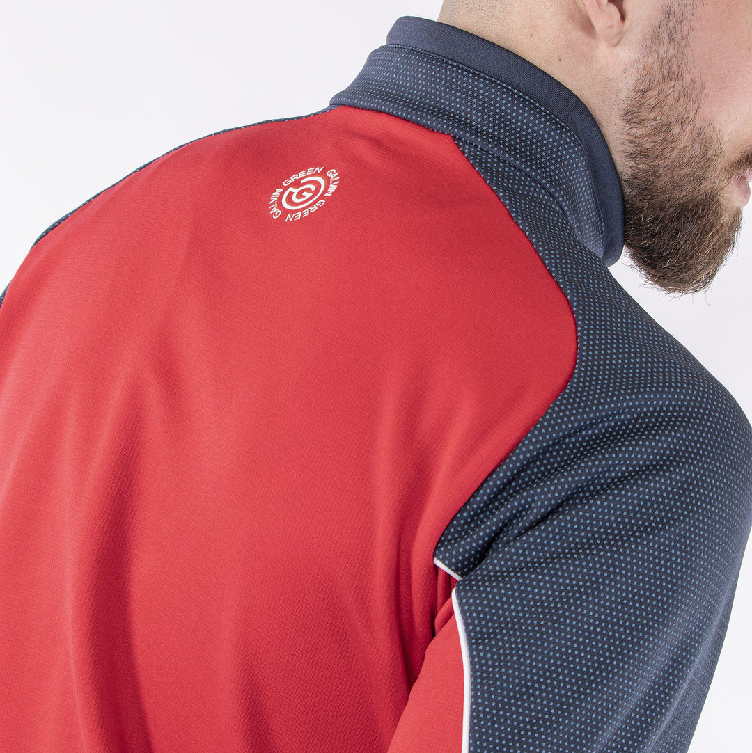 Daxton is a Insulating golf mid layer for Men in the color Sporty Red(8)