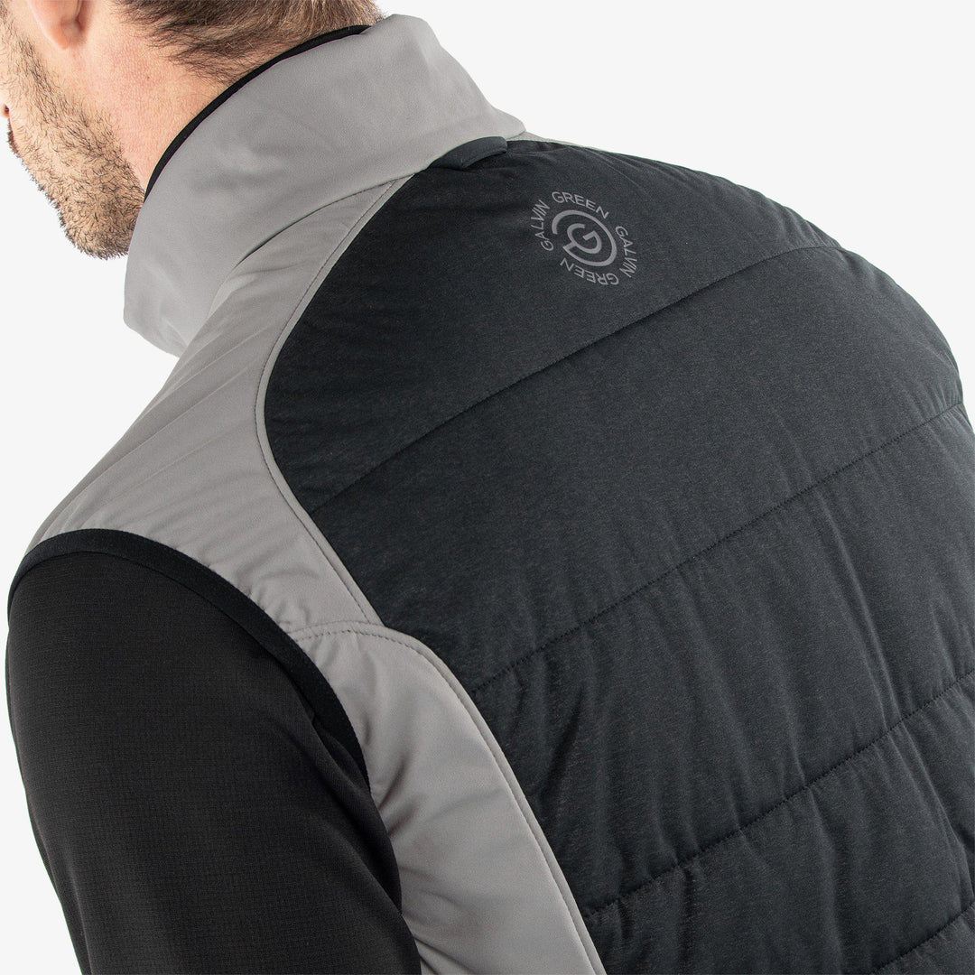 Lauro is a Windproof and water repellent vest for  in the color Sharkskin/Black(6)