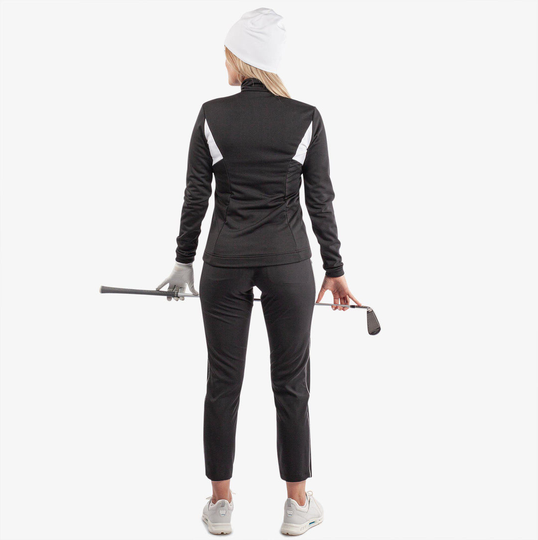 Destiny is a Insulating golf mid layer for Women in the color Black/White(6)