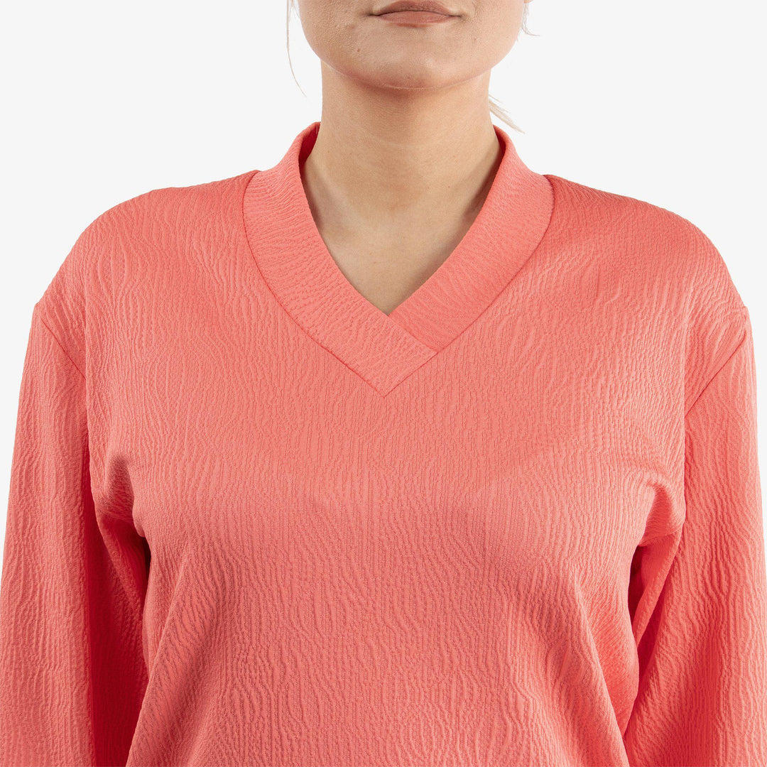 Donya is a Insulating golf mid layer for Women in the color Sugar Coral(4)