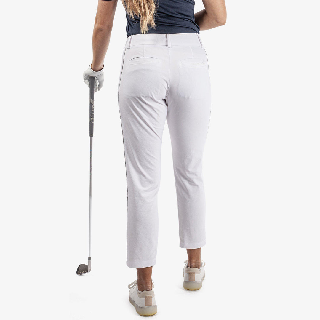 Nicole is a Breathable golf pants for Women in the color White/Cool Grey(5)