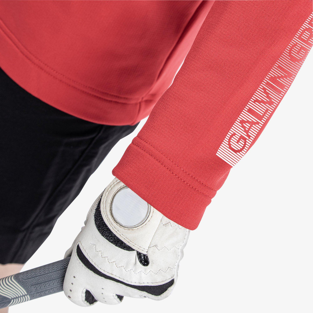 Raz is a Insulating golf mid layer for Juniors in the color Red(4)