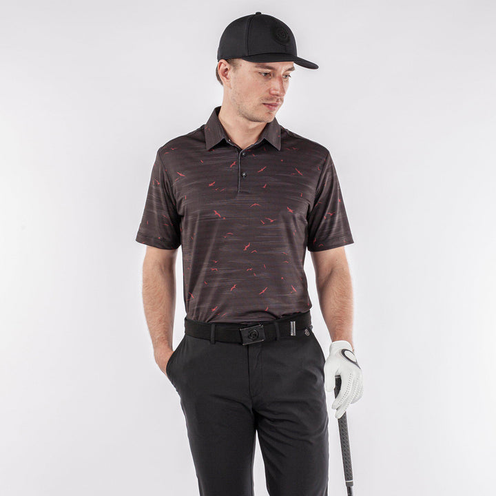 Marin is a Breathable short sleeve golf shirt for Men in the color Black/Red(1)