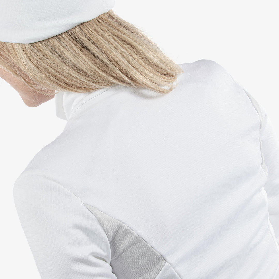 Destiny is a Insulating golf mid layer for Women in the color White/Cool Grey(5)