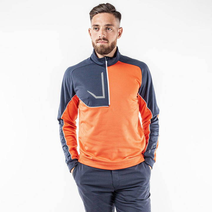 Daxton is a Insulating golf mid layer for Men in the color Orange(1)