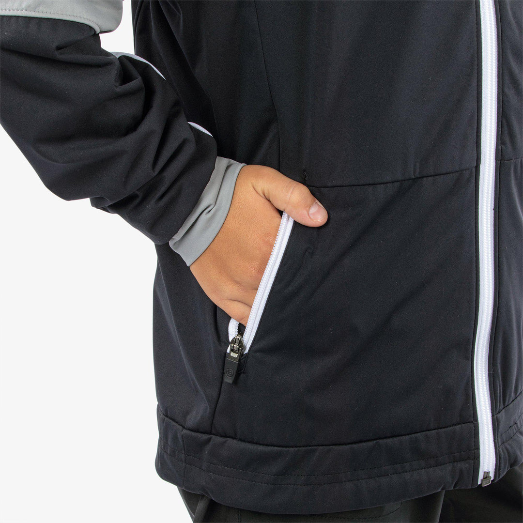 Remi is a Windproof and water repellent jacket for  in the color Black/Sharksin/White(6)