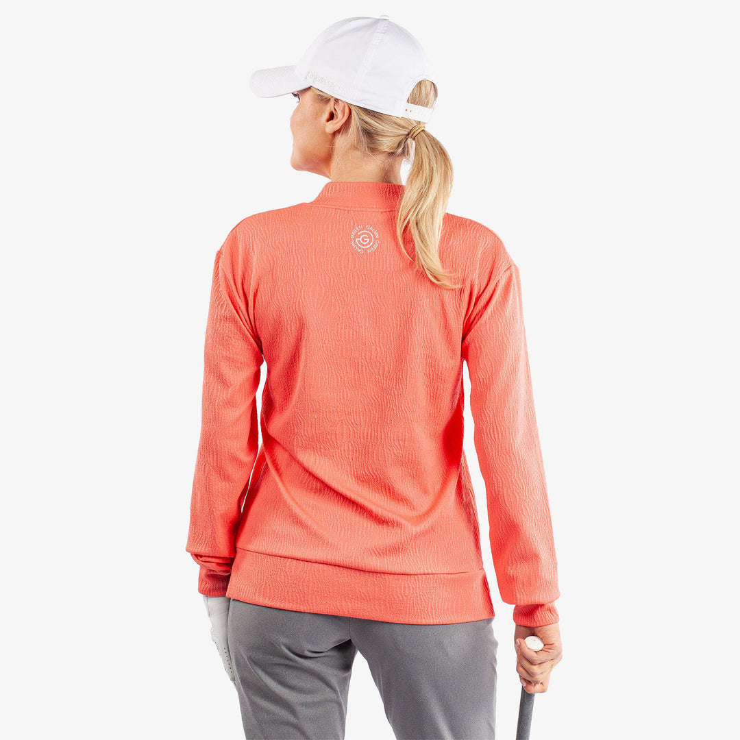 Donya is a Insulating golf mid layer for Women in the color Sugar Coral(6)