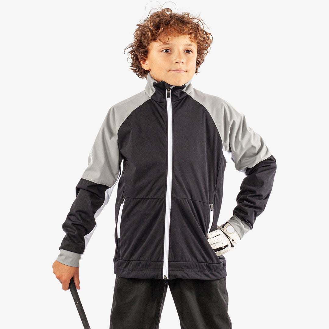 Remi is a Windproof and water repellent golf jacket for Juniors in the color Black/Sharksin/White(2)