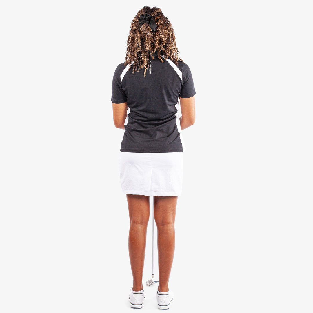 Mirelle is a Breathable short sleeve golf shirt for Women in the color Black/White(6)