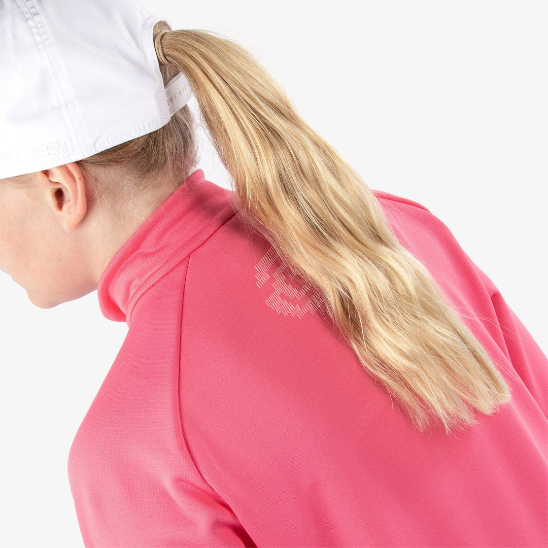 Raz is a Insulating golf mid layer for Juniors in the color Camelia Rose(5)