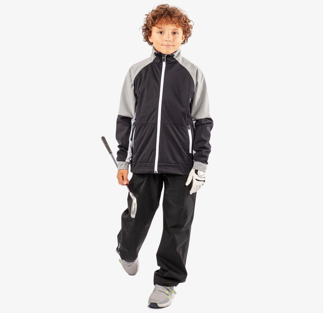 Remi is a Windproof and water repellent golf jacket for Juniors in the color Black/Sharksin/White(4)