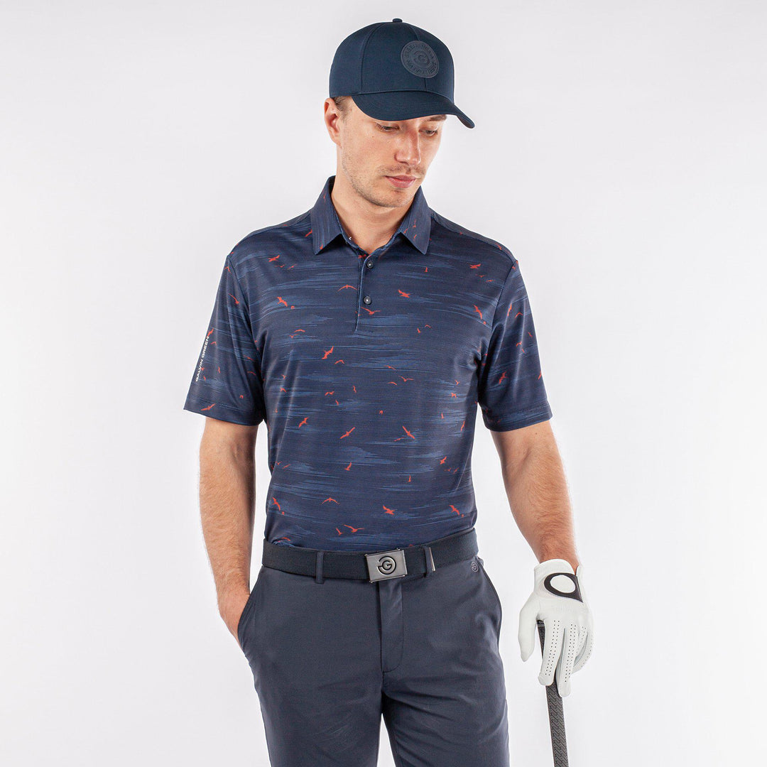 Marin is a Breathable short sleeve golf shirt for Men in the color Navy/Orange(1)