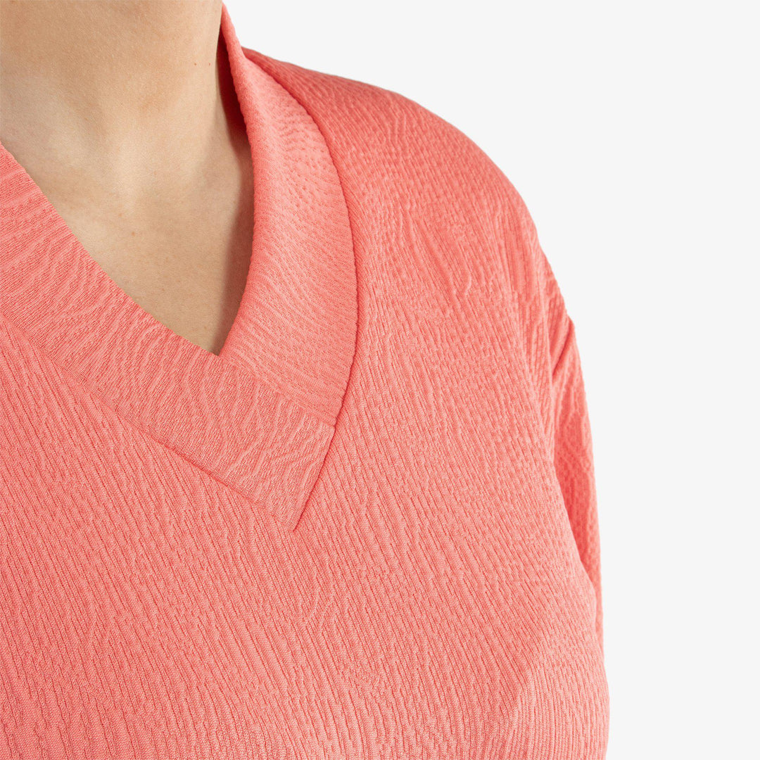 Donya is a Insulating golf mid layer for Women in the color Sugar Coral(5)