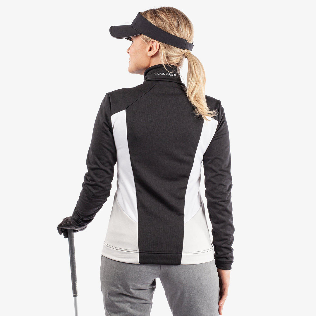 Donella is a Insulating golf mid layer for Women in the color Black/White/Cool Grey(7)