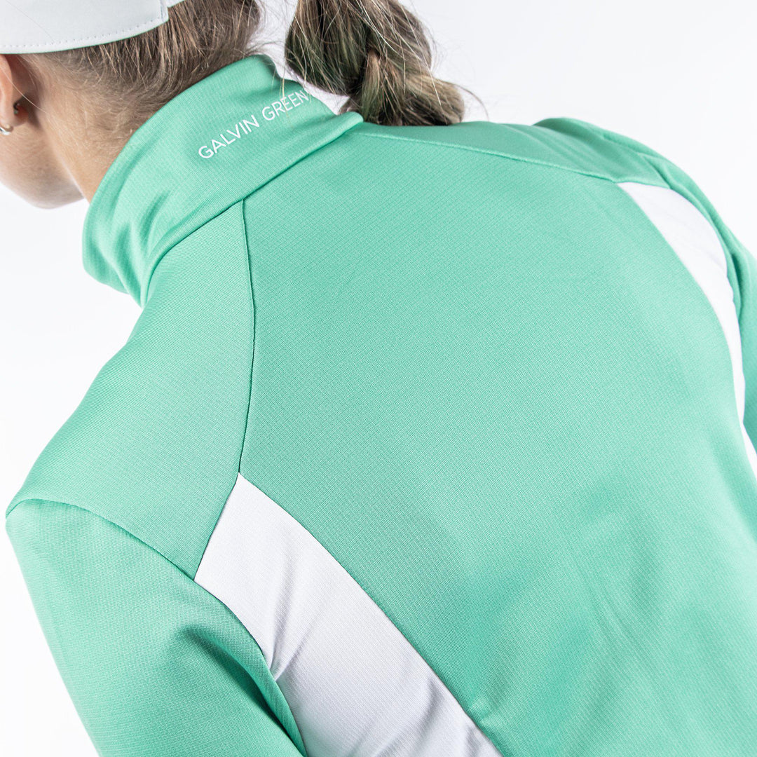 Donella is a Insulating golf mid layer for Women in the color Holly Green/White/Cool Grey(7)
