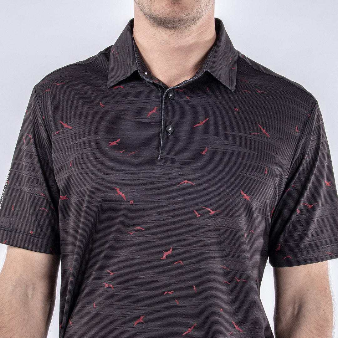 Marin is a Breathable short sleeve golf shirt for Men in the color Black/Red(4)