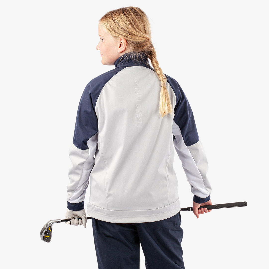 Remi is a Windproof and water repellent golf jacket for Juniors in the color Cool Grey/Navy/White(6)