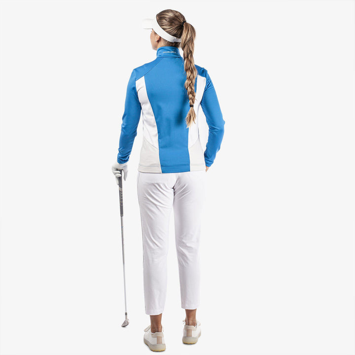 Donella is a Insulating golf mid layer for Women in the color Blue/White/Cool Grey(7)