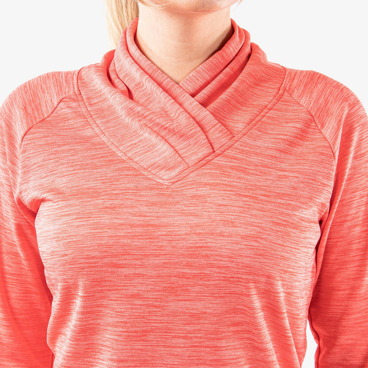 Dorali is a Insulating golf mid layer for Women in the color Sugar Coral(6)