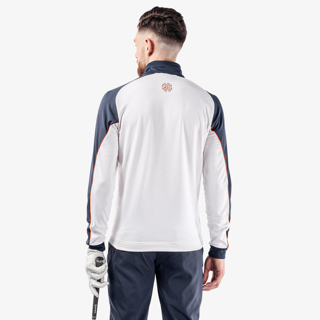 Daxton is a Insulating golf mid layer for Men in the color White/Navy/Orange(6)