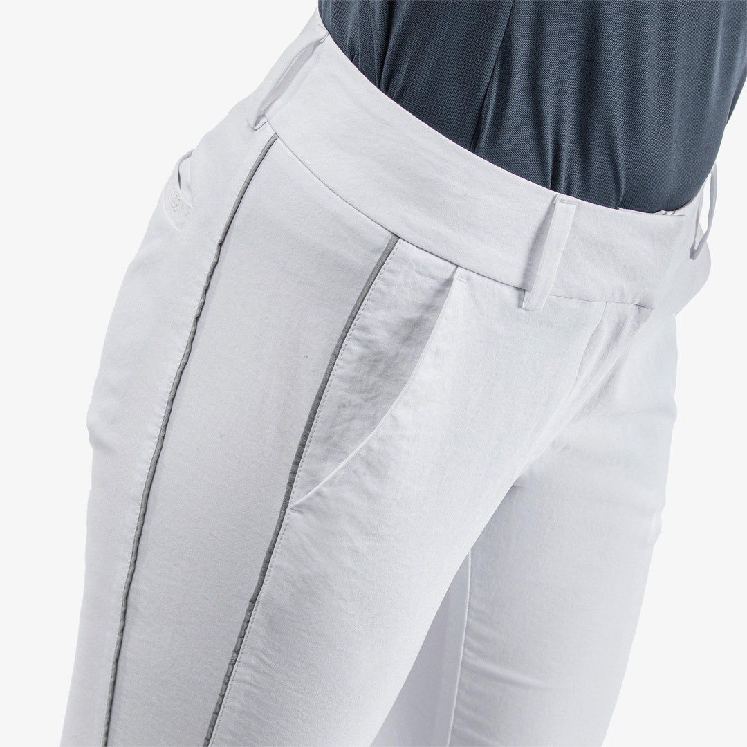 Nicole is a Breathable golf pants for Women in the color White/Cool Grey(3)