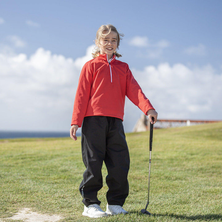 Raz is a Insulating golf mid layer for Juniors in the color Red(9)