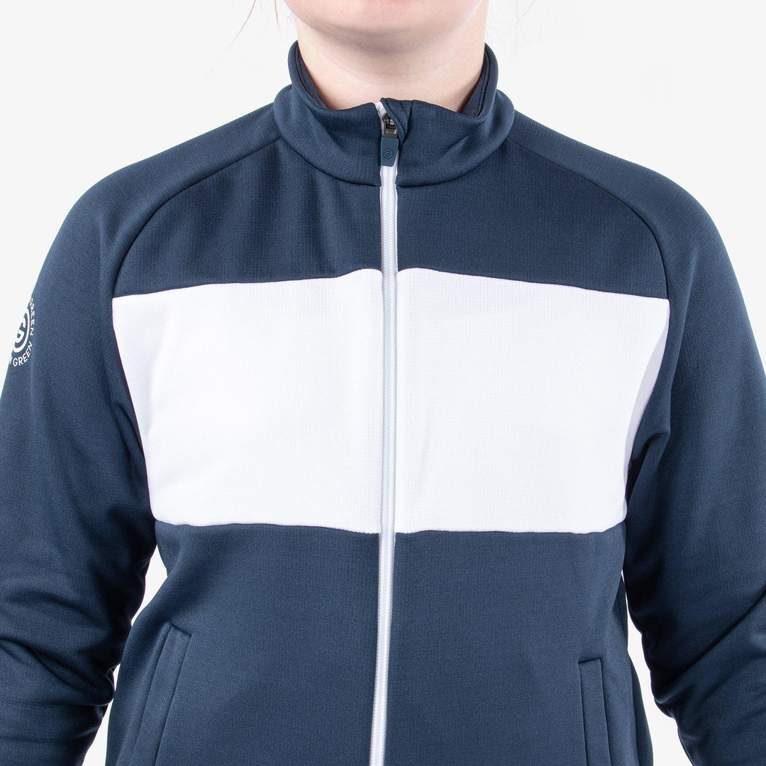 Rex is a Insulating golf mid layer for Juniors in the color Navy/White(4)