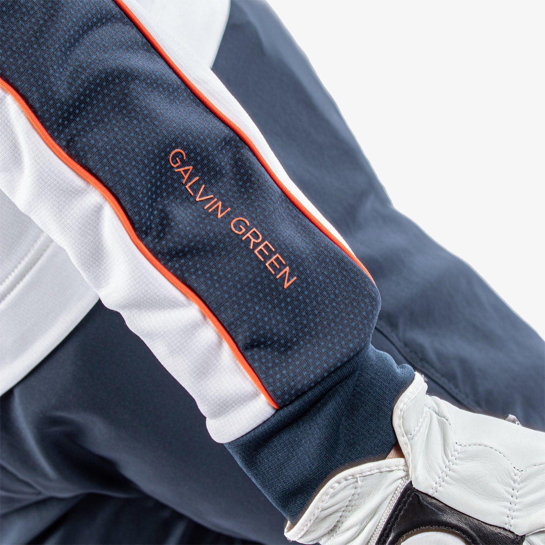 Daxton is a Insulating golf mid layer for Men in the color White/Navy/Orange(5)