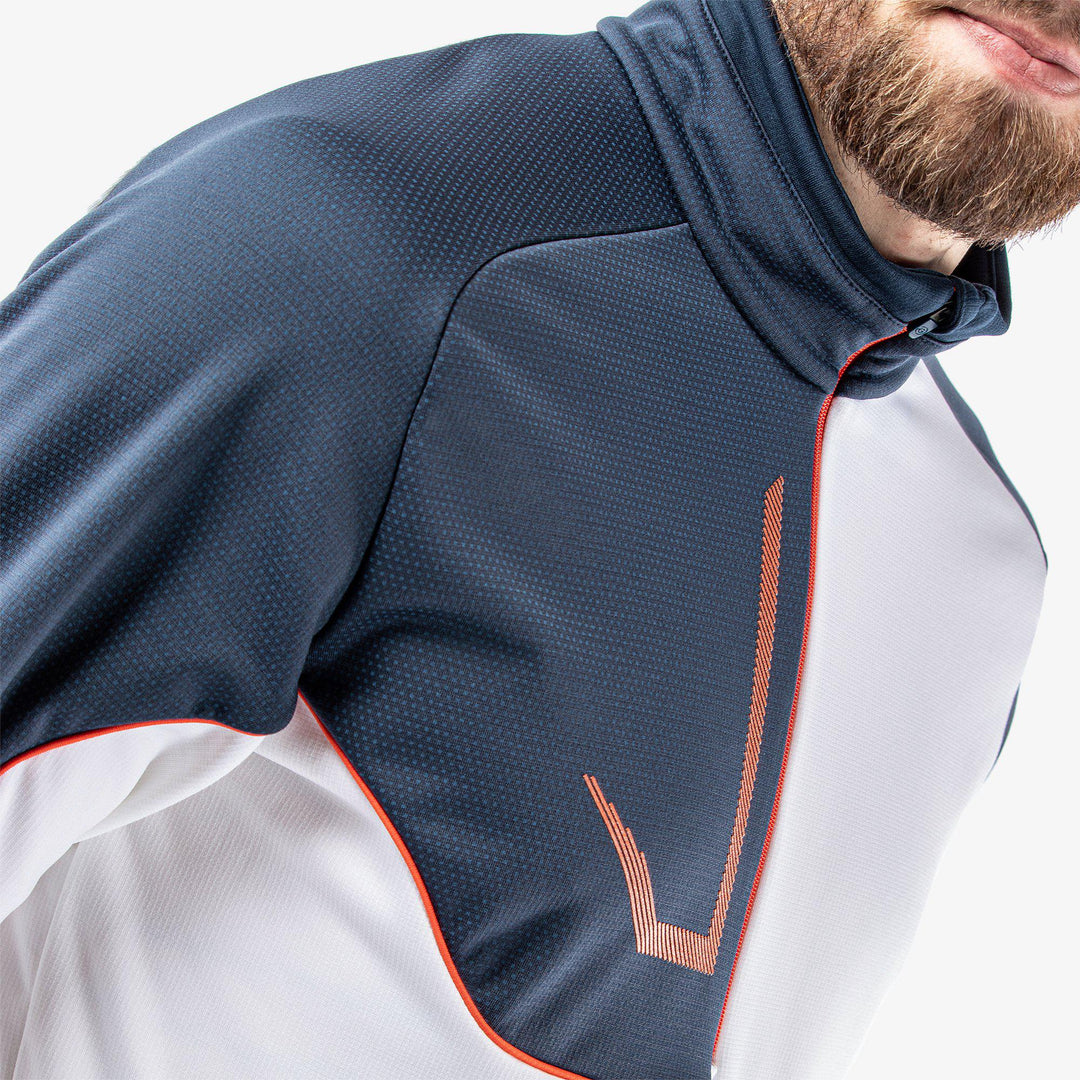 Daxton is a Insulating golf mid layer for Men in the color White/Navy/Orange(4)