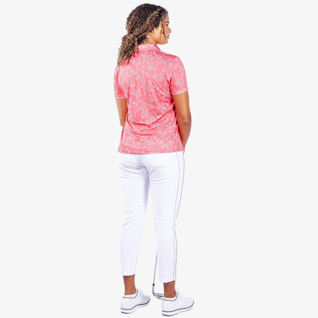 Mallory is a Breathable short sleeve golf shirt for Women in the color Camelia Rose/White(6)