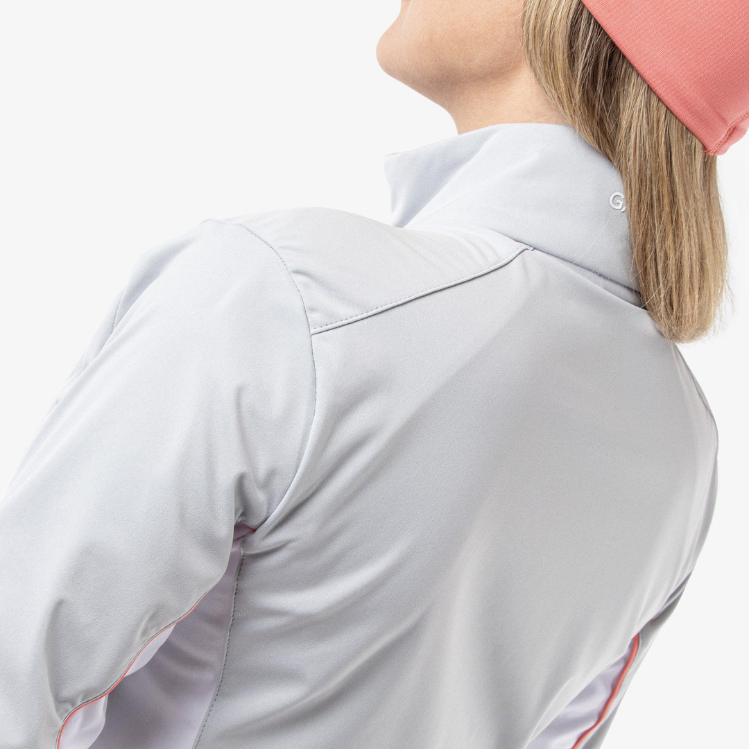Larissa is a Windproof and water repellent golf jacket for Women in the color Cool Grey/White/Coral(8)