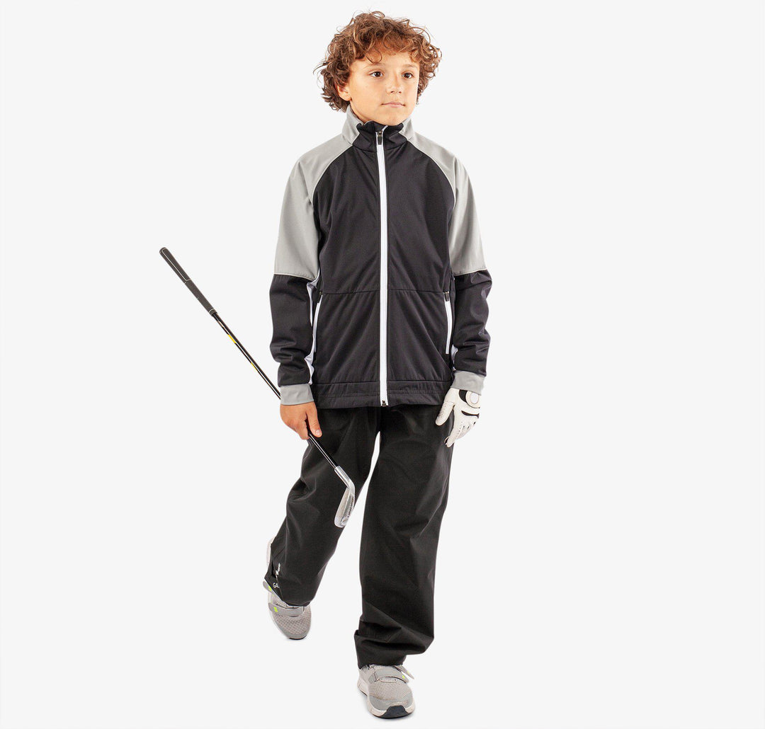 Remi is a Windproof and water repellent golf jacket for Juniors in the color Black/Sharksin/White(3)