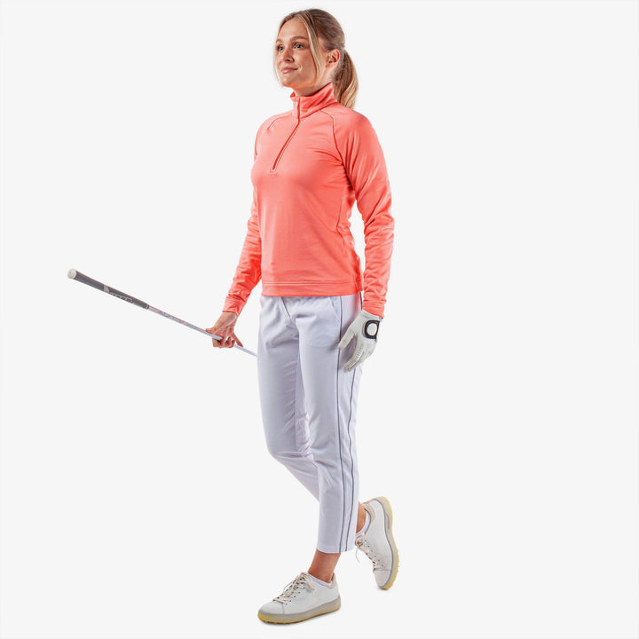Dolly is a Insulating golf mid layer for Women in the color Coral(2)