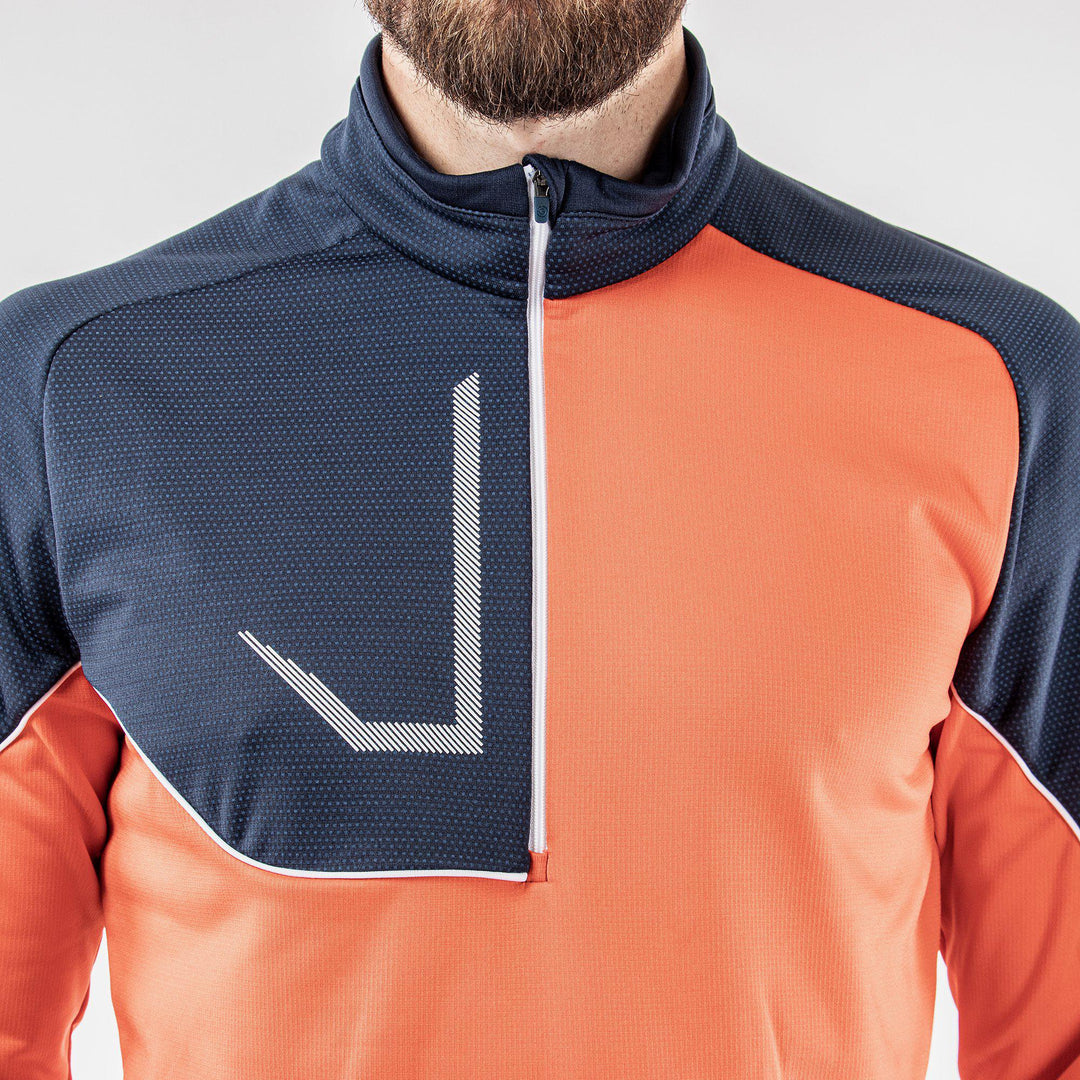 Daxton is a Insulating golf mid layer for Men in the color Orange(4)